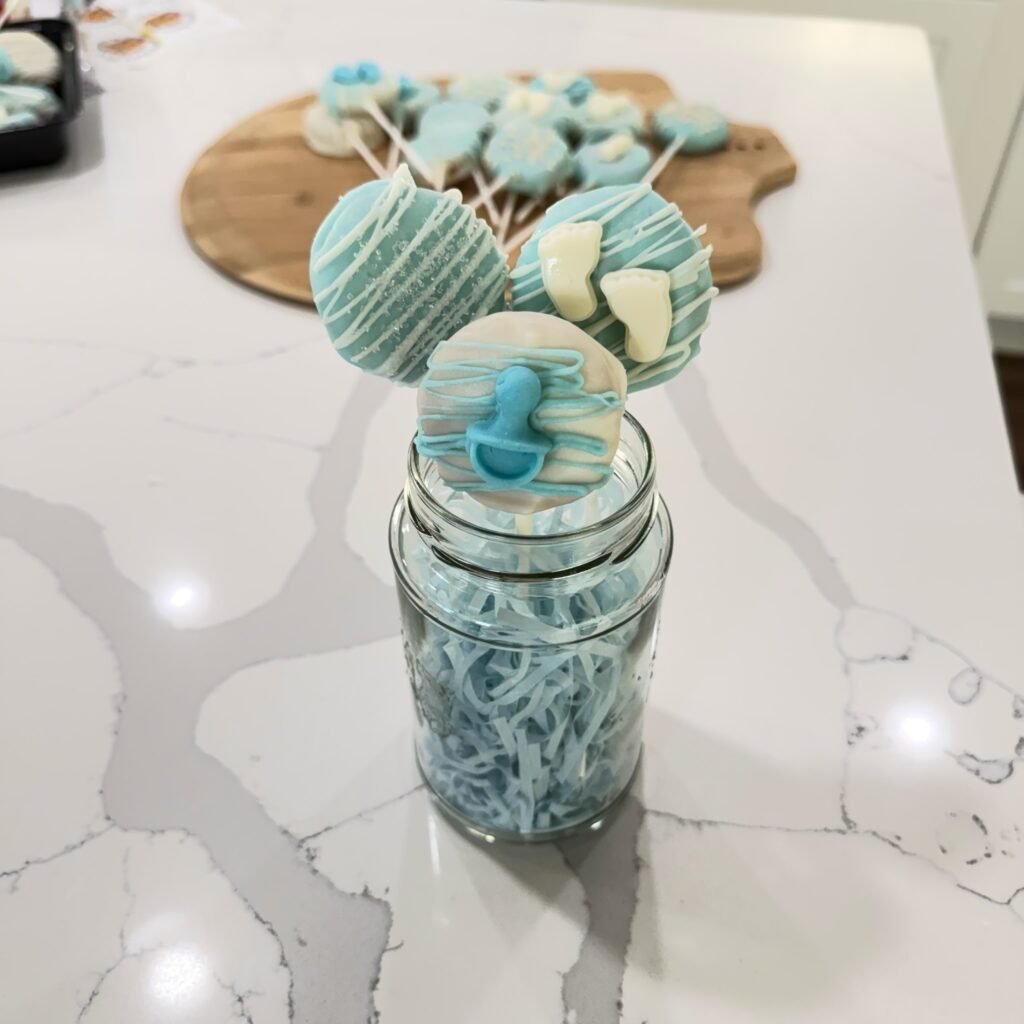 Briana from Sweet Bri’s Bakery holding baked goods